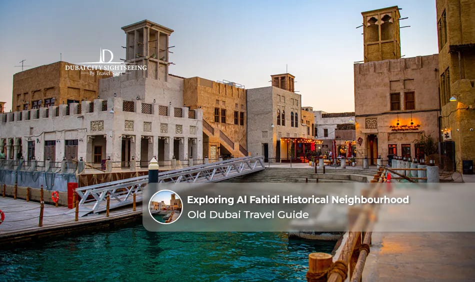 Visitors exploring the historic streets and traditional wind-tower houses of Al Fahidi Historical Neighbourhood in Dubai.